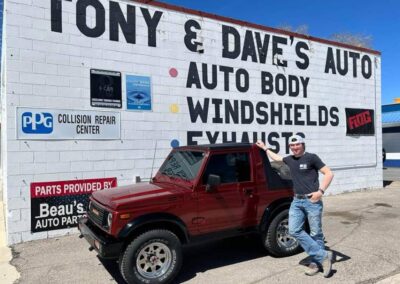 view of the car parked outside Tony & Dave's Auto Body Center